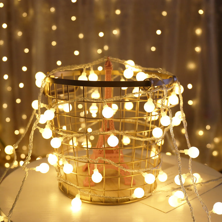 VibeCore tiny ball string lights with warm white LEDs, creating a soft, cozy glow. Battery-powered for portable and easy use in any space.