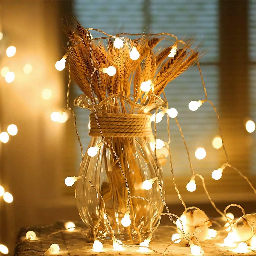 VibeCore Tiny Ball String Lights Close Up On Dried Grass In Glass Vase