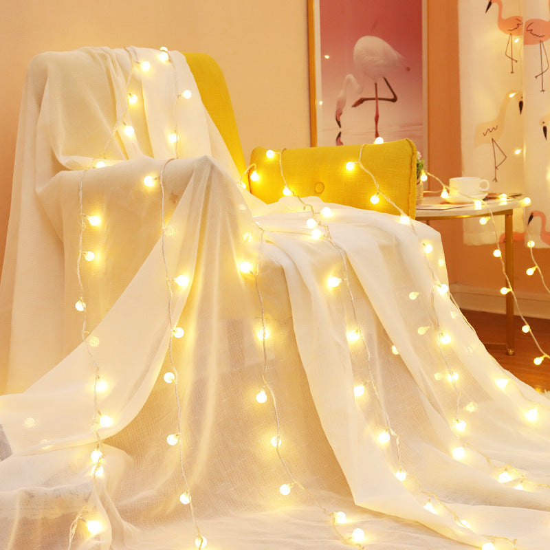 VibeCore tiny ball string lights in living room, creating a warm, inviting ambiance with a soft, cozy glow.
