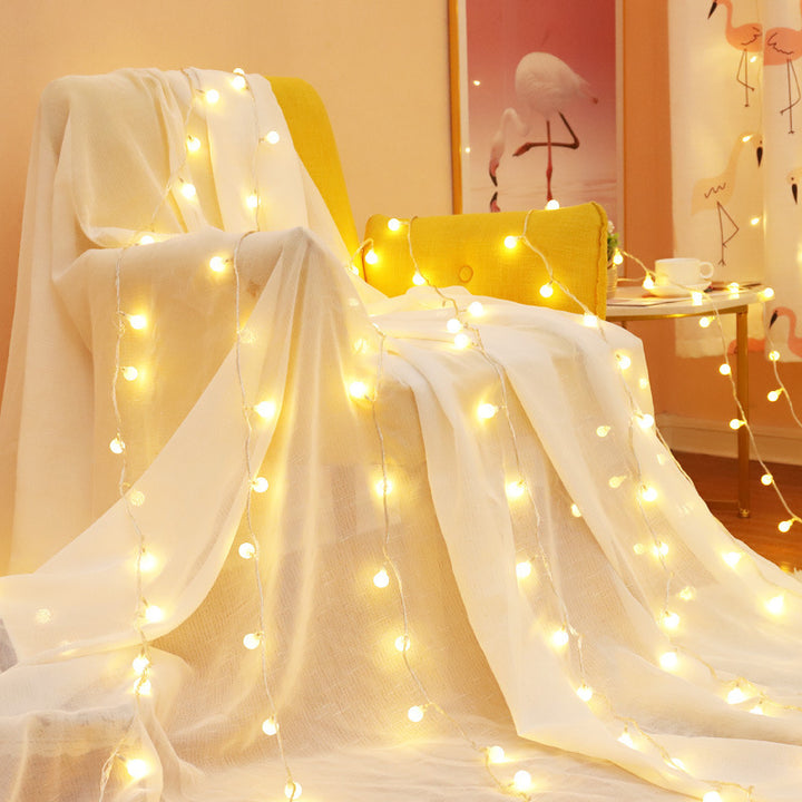 VibeCore tiny ball string lights in living room, creating a warm, inviting ambiance with a soft, cozy glow.