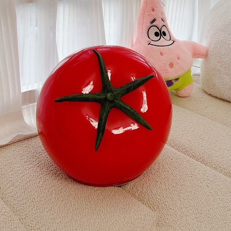 A quirky, tomato-shaped glass table lamp in bold red, unlit and showcasing its vibrant, glossy finish—perfect for eclectic and dopamine decor aesthetics.
