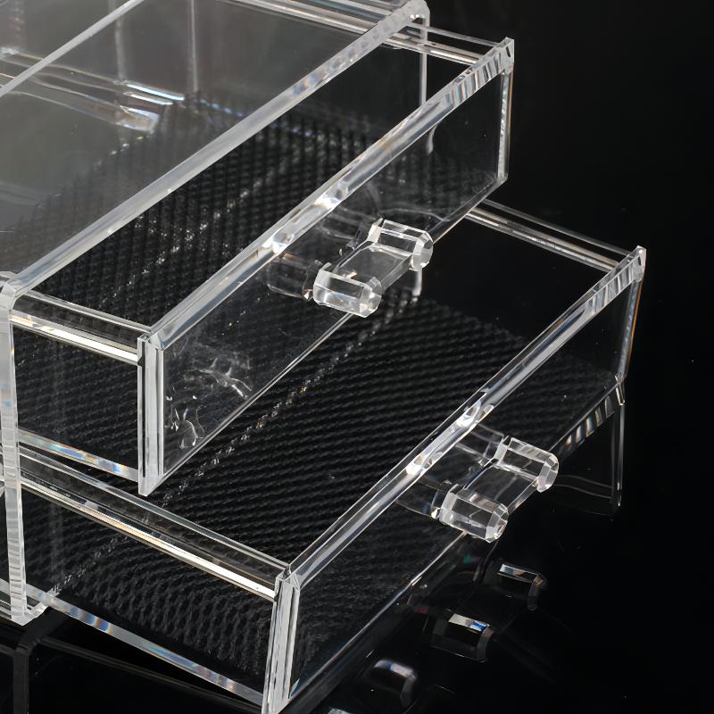 Close-up of the drawer in the acrylic organizer, featuring neatly stored cosmetics and skincare products in a clear, space-saving design.