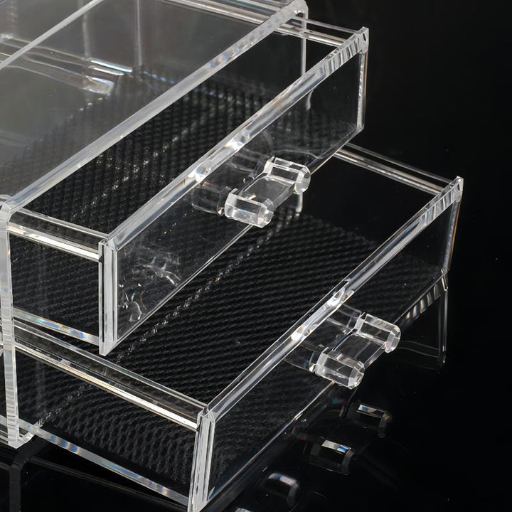 Close-up of the drawer in the acrylic organizer, featuring neatly stored cosmetics and skincare products in a clear, space-saving design.