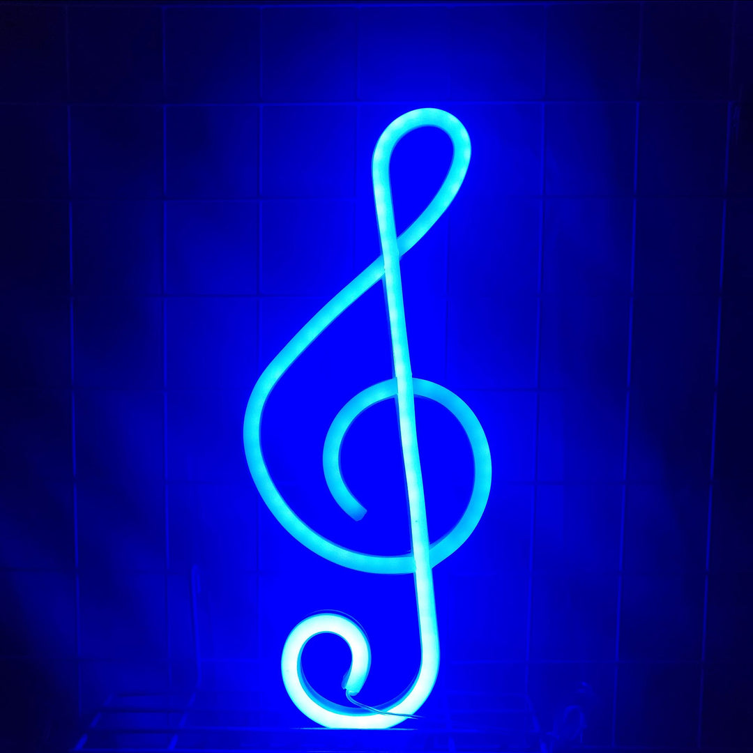 Treble Clef Neon Light in blue, casting a vibrant glow that adds a musical and dynamic touch to the space.