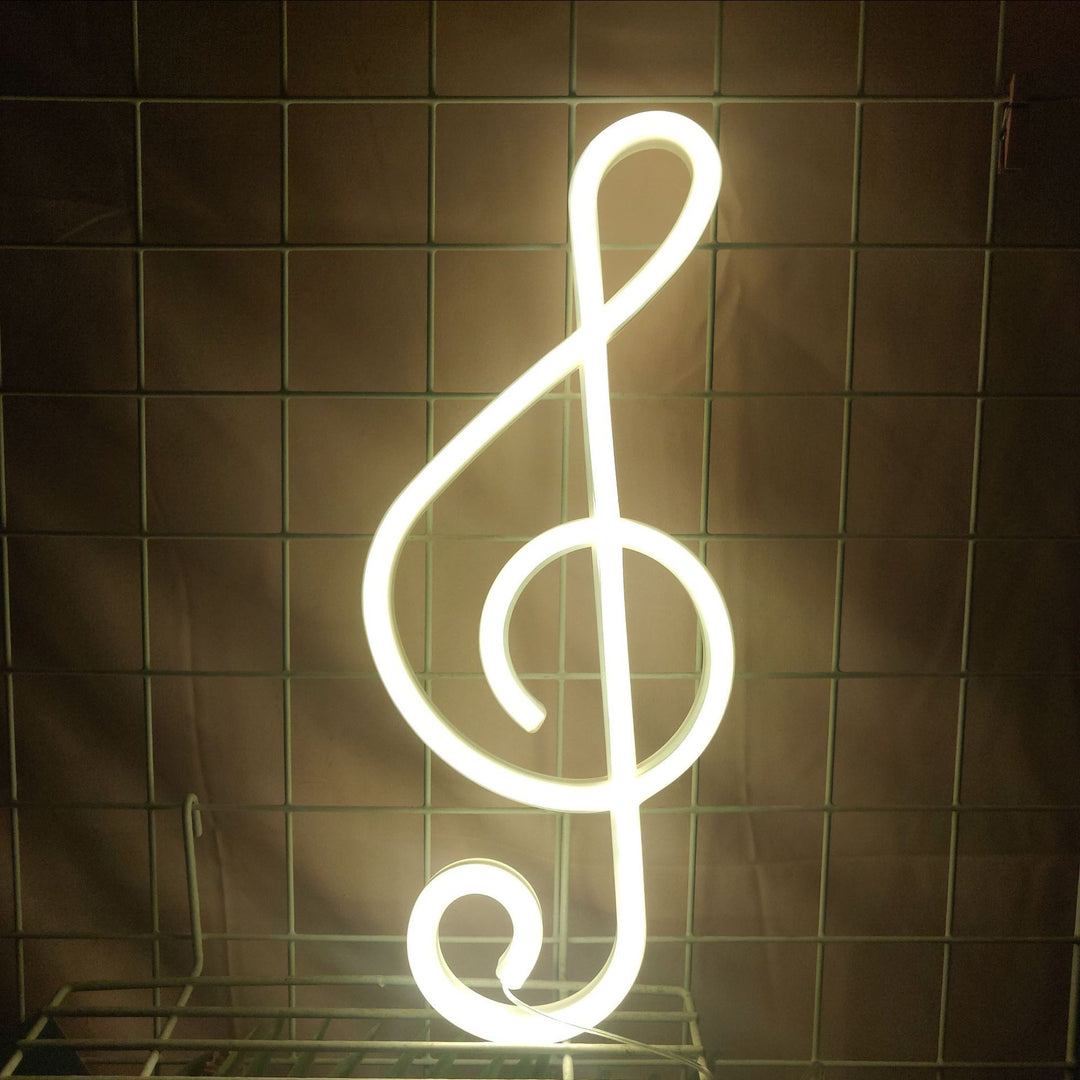 The "Treble Clef Neon Light" adds a vibrant, musical vibe with its warm white glow, perfect for music lovers. Ideal for bedrooms, dorms, or music rooms, this neon sign creates a stylish and lively atmosphere in any space.