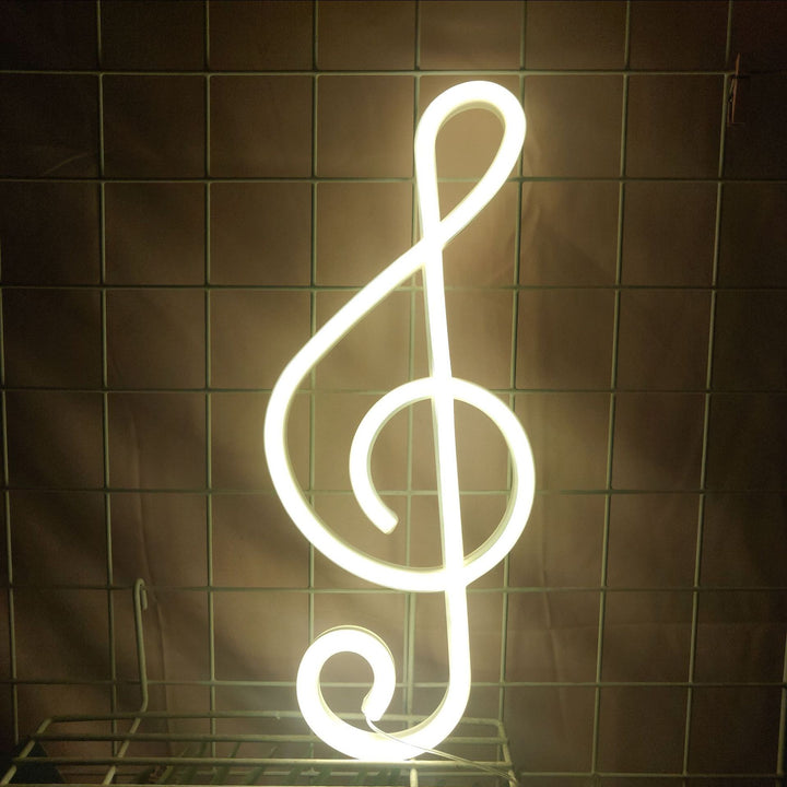The "Treble Clef Neon Light" adds a vibrant, musical vibe with its warm white glow, perfect for music lovers. Ideal for bedrooms, dorms, or music rooms, this neon sign creates a stylish and lively atmosphere in any space.