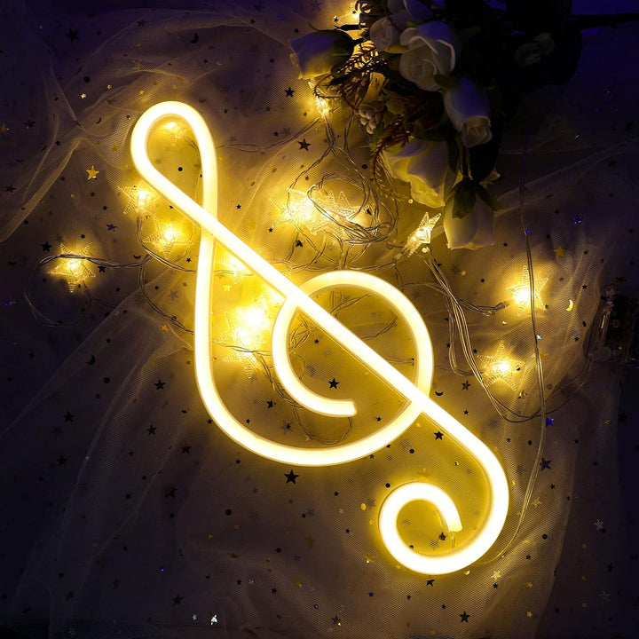 Treble Clef Neon Light Warm White laying down on a surface with a soft glow, creating a cozy and musical atmosphere.