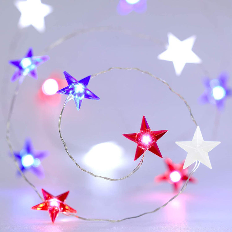 VibeCore Tricolor Stars Fairy Lights featuring blue, red, and white stars. Battery-powered with 30 lights, 8 light modes, and a remote control for easy adjustments. Ideal for adding a pop of color to any space.