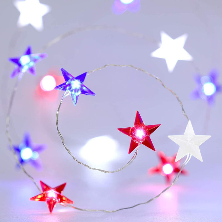 VibeCore Tricolor Stars Fairy Lights featuring blue, red, and white stars. Battery-powered with 30 lights, 8 light modes, and a remote control for easy adjustments. Ideal for adding a pop of color to any space.