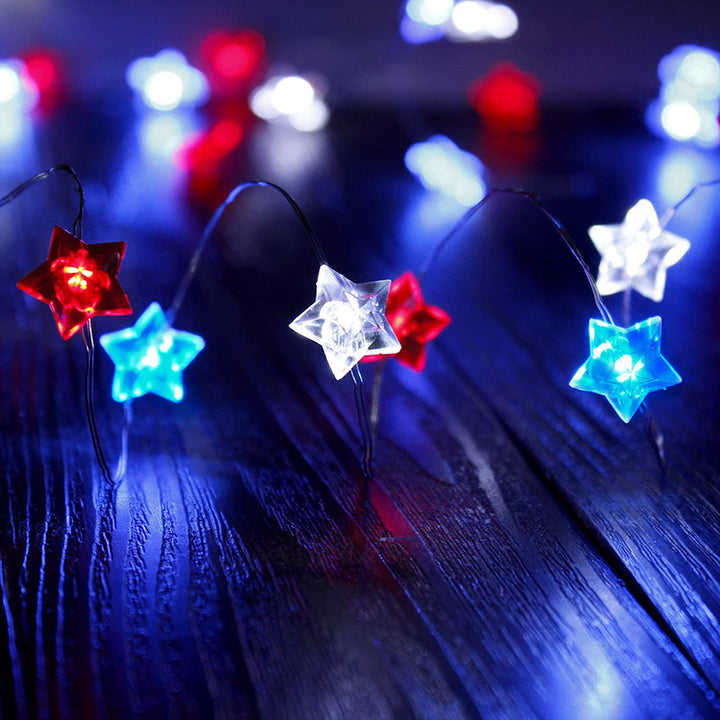 VibeCore Tricolor Stars Fairy Lights showcasing vibrant blue, red, and white stars, offering a playful, colorful glow. Battery-powered with remote control for easy adjustment.