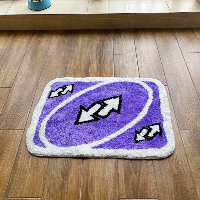 VibeCore UNO Reverse Accent Rug Aerial View showcasing its bold purple design, urban style, rectangular shape, nostalgic UNO theme, soft texture, non-slip backing, playful aesthetic, and vibrant addition to living room, bedroom, dorm, or apartment.