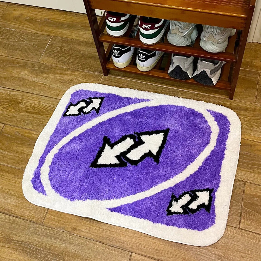VibeCore UNO Reverse Accent Rug placed in front of a shoe rack, showcasing its vibrant purple color, nostalgic UNO theme, soft texture, and modern aesthetic. Perfect for adding a playful and unique touch to any room, ideal for living rooms, bedrooms, and dorms.