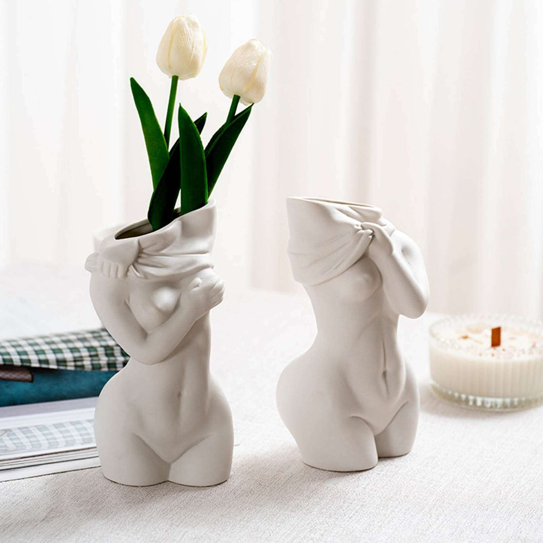 Sculptural minimalist design, crafted from white porcelain with smooth curves and subtle foggy finish. Artistic and elegant female form, perfect for modern decor.