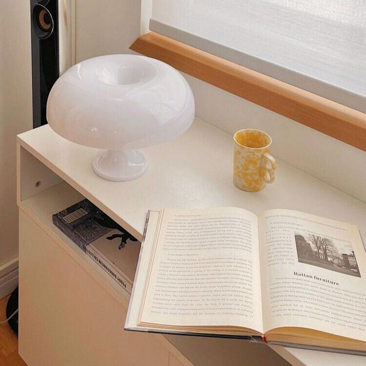 VibeCore Vintage 60s Mushroom Lamp in white, placed by the window, casting a soft glow and enhancing the room's ambiance.