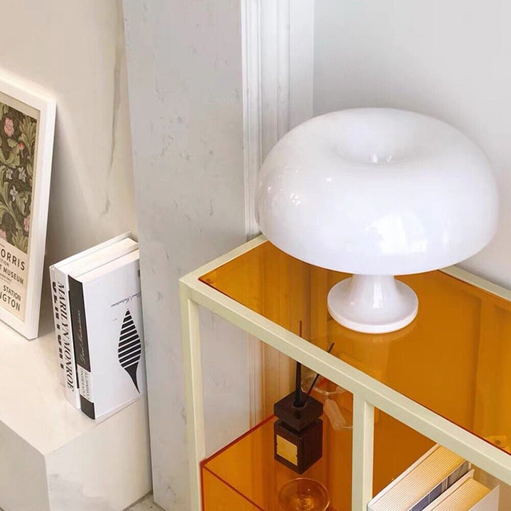 VibeCore Vintage 60s Mushroom Lamp in white, placed in a living room, adding a retro and warm glow to the space.