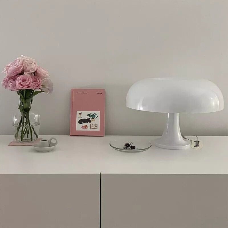 VibeCore Vintage 60s Mushroom Lamp in white, placed on a dresser, casting a cozy and nostalgic glow in the room.