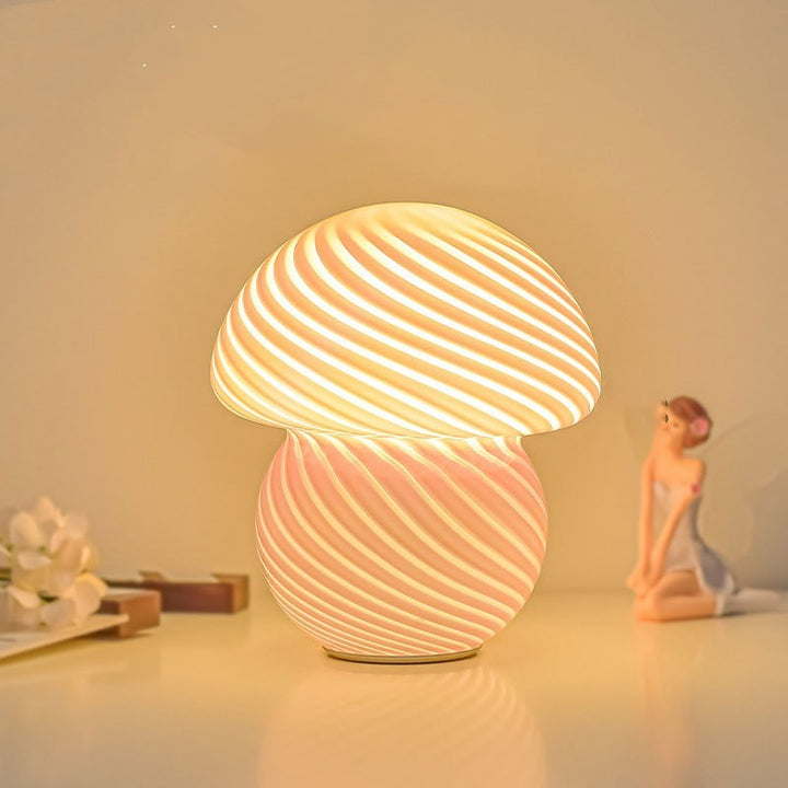 VibeCore Vintage Mushroom Glass Stripe Lamp lit, showcasing its hand-blown striped glass design and soft, dimmable glow, adding a touch of retro charm to the space.