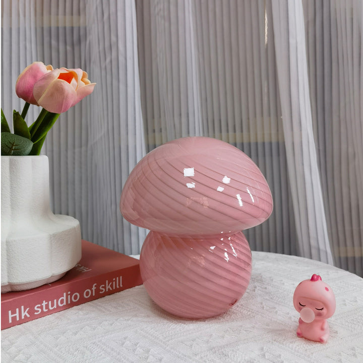 VibeCore Vintage Mushroom Glass Stripe Lamp in pink, showcasing a hand-blown striped glass design that offers a warm, cozy glow, adding a retro touch to any room with its soft ambiance.