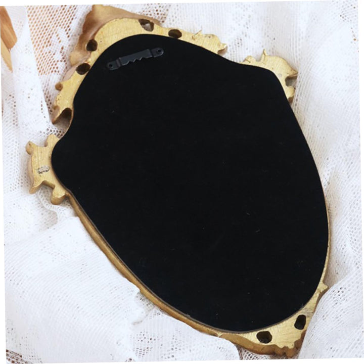 VibeCore Vintage Princess Coquette Mirror showing the backing, highlighting the durable resin construction and secure mounting hooks, ensuring stability and easy wall installation for a seamless, elegant display.