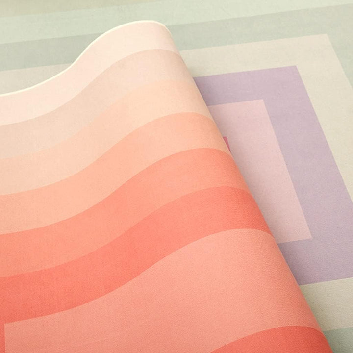 VibeCore Watercolor Gradient Area Rug Coral Pink material close-up, showcasing the soft, smooth texture and vibrant coral pink gradient design.