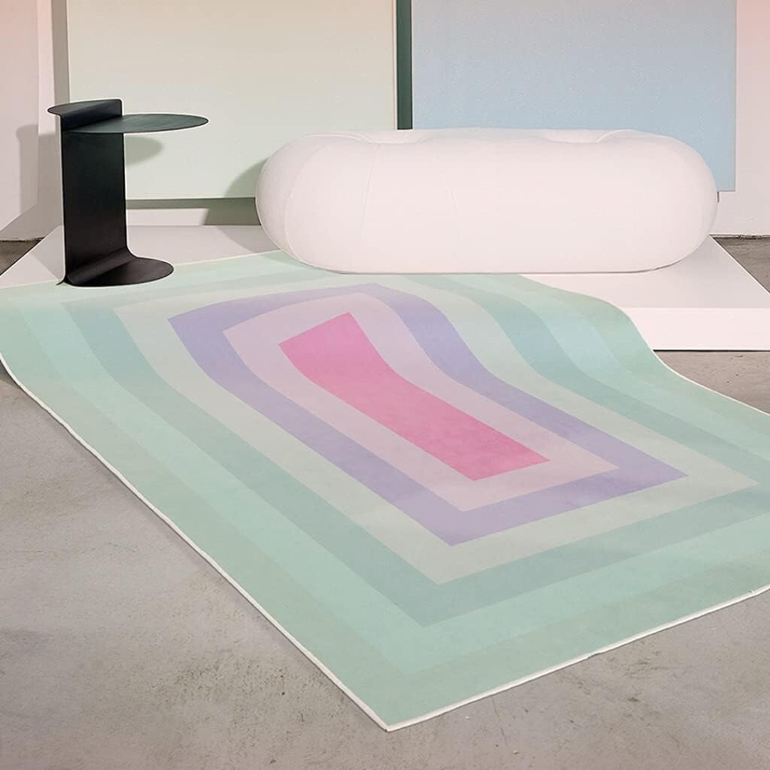 VibeCore Watercolor Gradient Area Rug Turquoise on cement floor, featuring a vibrant turquoise gradient pattern that adds a modern, artistic touch to the room's aesthetic.