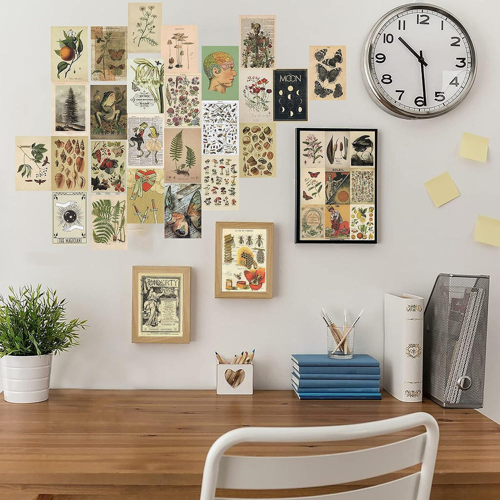 VibeCore Witchcore Wall Collage Kit on wall above desk featuring 70 enchanting witchcore and nature-inspired prints. Perfect for workspace decor, mystical vibes, witchy aesthetics, dorm room styling, nature-inspired art, and personalized study space.