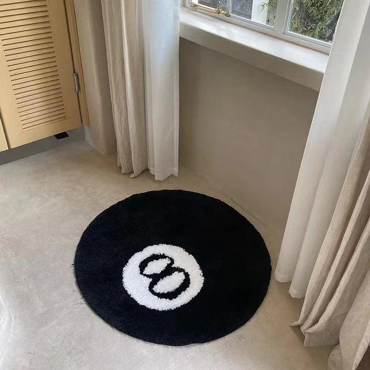 Aerial view of the VibeCore Lucky 8 Ball Rug, showcasing its black and white billiard ball design. Perfect for adding an aesthetic, contemporary touch to any floor, whether it be in a bedroom, living room, dorm or bathroom. 