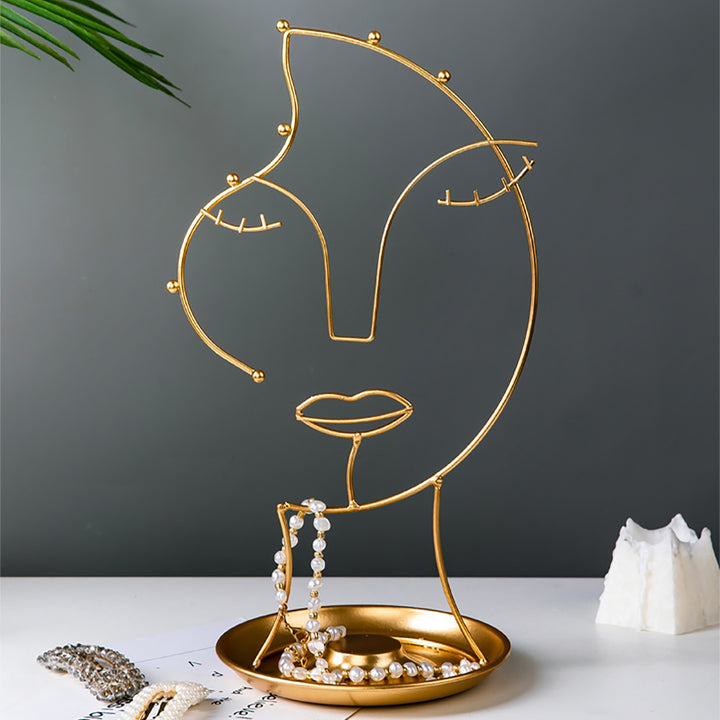 VibeCore Abstract Beauty Jewelry Stand, featuring a unique abstract female face design in durable gold iron metal, perfect for organizing jewelry while adding an artistic touch to any space.