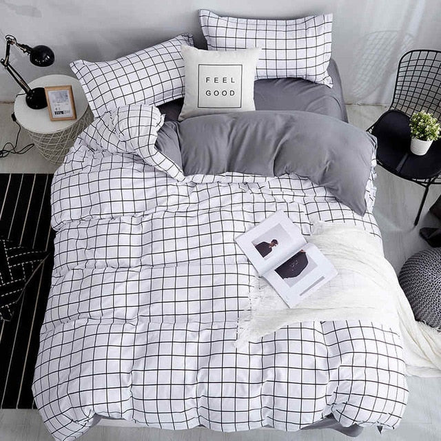 Aerial view of the VibeCore Black and White Grid Bedding Set, featuring a minimalist grid pattern and made from a soft, breathable cotton-polyester blend. This trendy bedding set combines cozy comfort with modern aesthetic vibes, perfect for dorms or bedrooms. Fade-resistant and easy to care for, it’s ideal for creating a fresh, Pinterest-worthy space with timeless style.