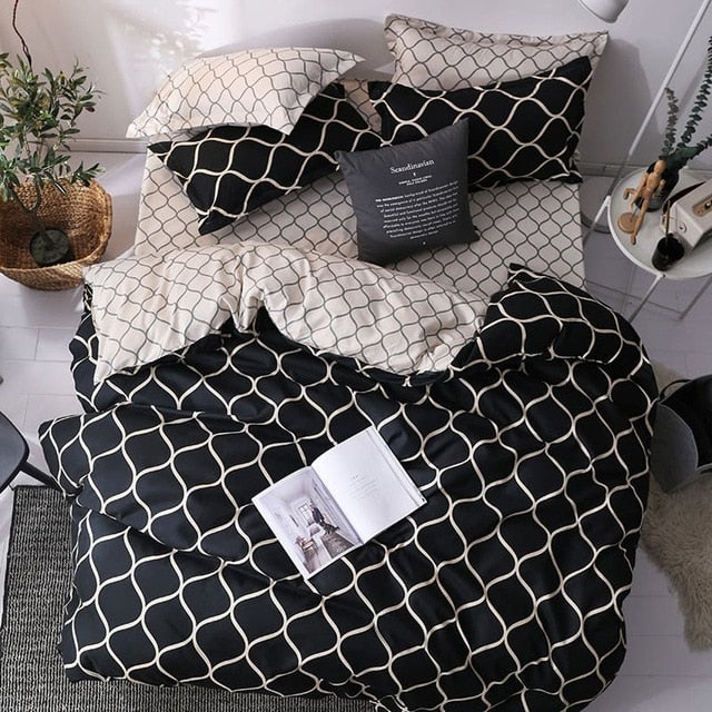 Aerial view of the VibeCore Aesthetic Black Beehive Duvet Cover Set, featuring a bold, modern beehive pattern in black and gold. Made from a soft cotton-polyester blend, this bedding set adds a touch of sophistication and comfort to any contemporary bedroom or dorm room.