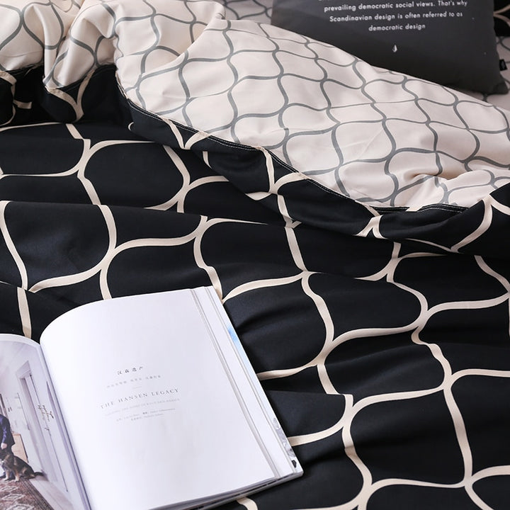 Close-up of the VibeCore Aesthetic Black Beehive Duvet Cover Set pattern, featuring a bold black and gold beehive design. The geometric pattern adds a modern, edgy touch to your bedroom or dorm, while the soft cotton-polyester blend ensures comfort and durability.