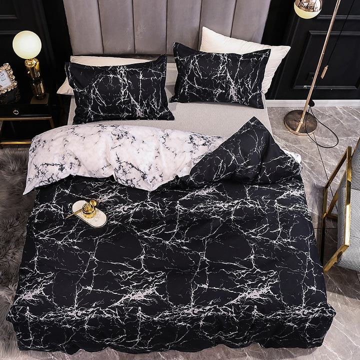 Aerial view of the VibeCore Aesthetic Black Marble Duvet Cover Set, showcasing a sleek and sophisticated black marble pattern. Made from a durable cotton-polyester blend, this bedding set offers year-round comfort and versatility, with a reversible design to elevate the aesthetic of any bedroom or dorm.