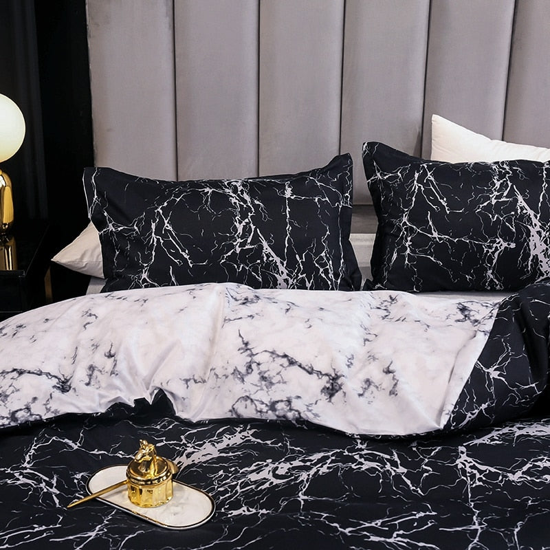 Close-up of the VibeCore Aesthetic Black Marble Duvet Cover Set, highlighting the sleek black marble pattern and the smooth texture of the cotton-polyester blend material. This elegant design adds a sophisticated, modern touch to any bedroom or dorm, while offering year-round comfort and style.