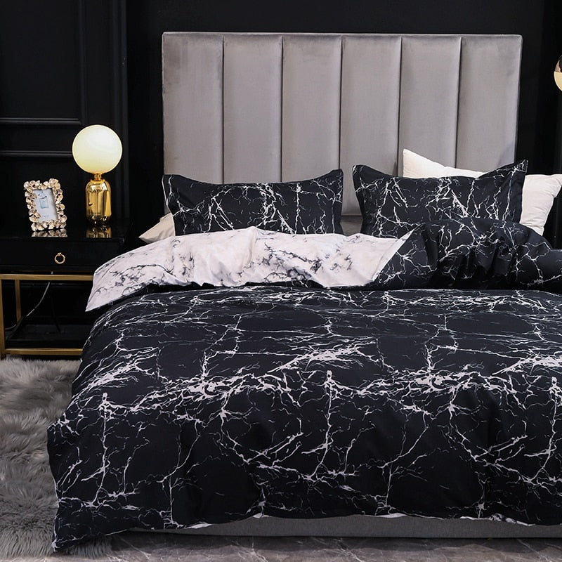 Front view of the VibeCore Aesthetic Black Marble Duvet Cover Set, featuring a sleek black marble design. The durable cotton-polyester blend provides year-round comfort, while the sophisticated pattern adds modern elegance to any bedroom or dorm. Reversible design offers two stylish looks in one set.