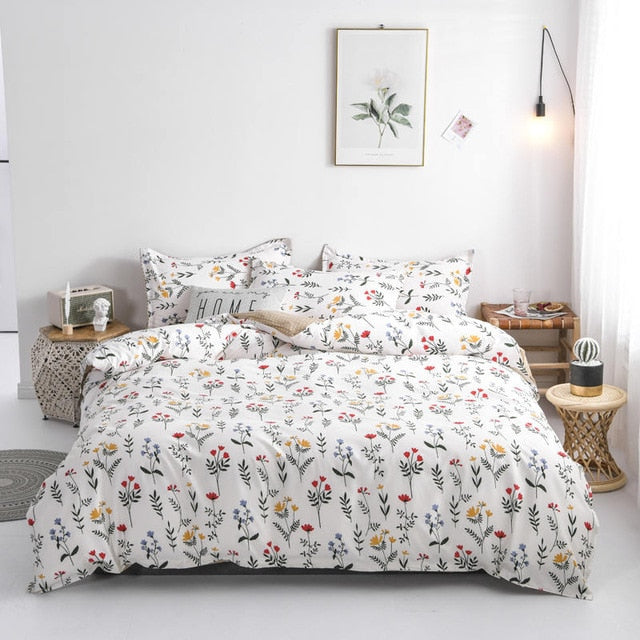 Aerial view of the VibeCore Aesthetic Colorful Flower Duvet Cover Set, featuring vibrant floral patterns in bold colors. Made from a soft cotton-polyester blend, this duvet set brings a cheerful, nature-inspired touch to any bedroom or dorm room, combining style and comfort.