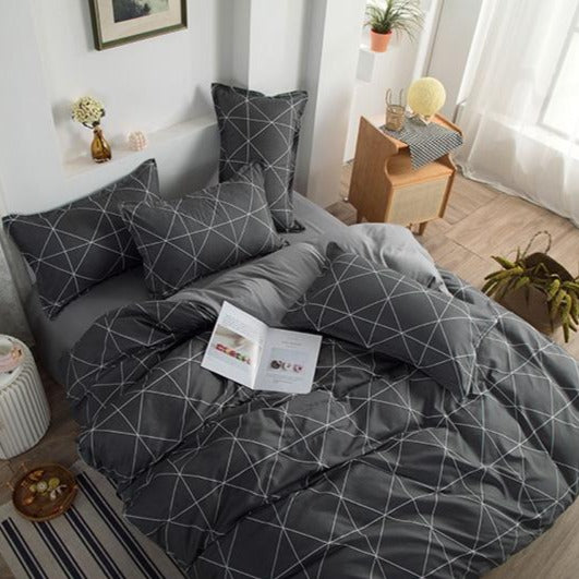 Aerial angled view of VibeCore Aesthetic Gray Geometric Duvet Cover Set, showcasing modern geometric patterns in sophisticated gray tones. Made from a soft cotton-polyester blend, this bedding set adds contemporary style and comfort to any bedroom or dorm room.