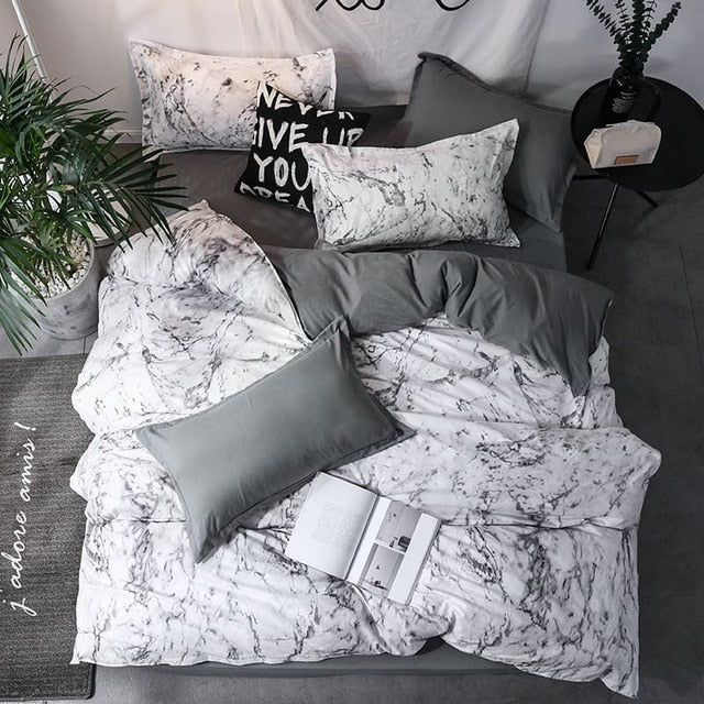 Aerial view of VibeCore Aesthetic White Marble Duvet Cover Set with sleek white marble pattern, featuring durable cotton and polyester blend fabric. Ideal for modern bedrooms and dorm rooms, this duvet cover set offers year-round comfort with its lightweight, breathable design. Machine washable and easy to care for, this bedding set is perfect for adding elegance and sophistication to your space. Available in Queen/King and Single/Twin sizes for a perfect fit in any room.