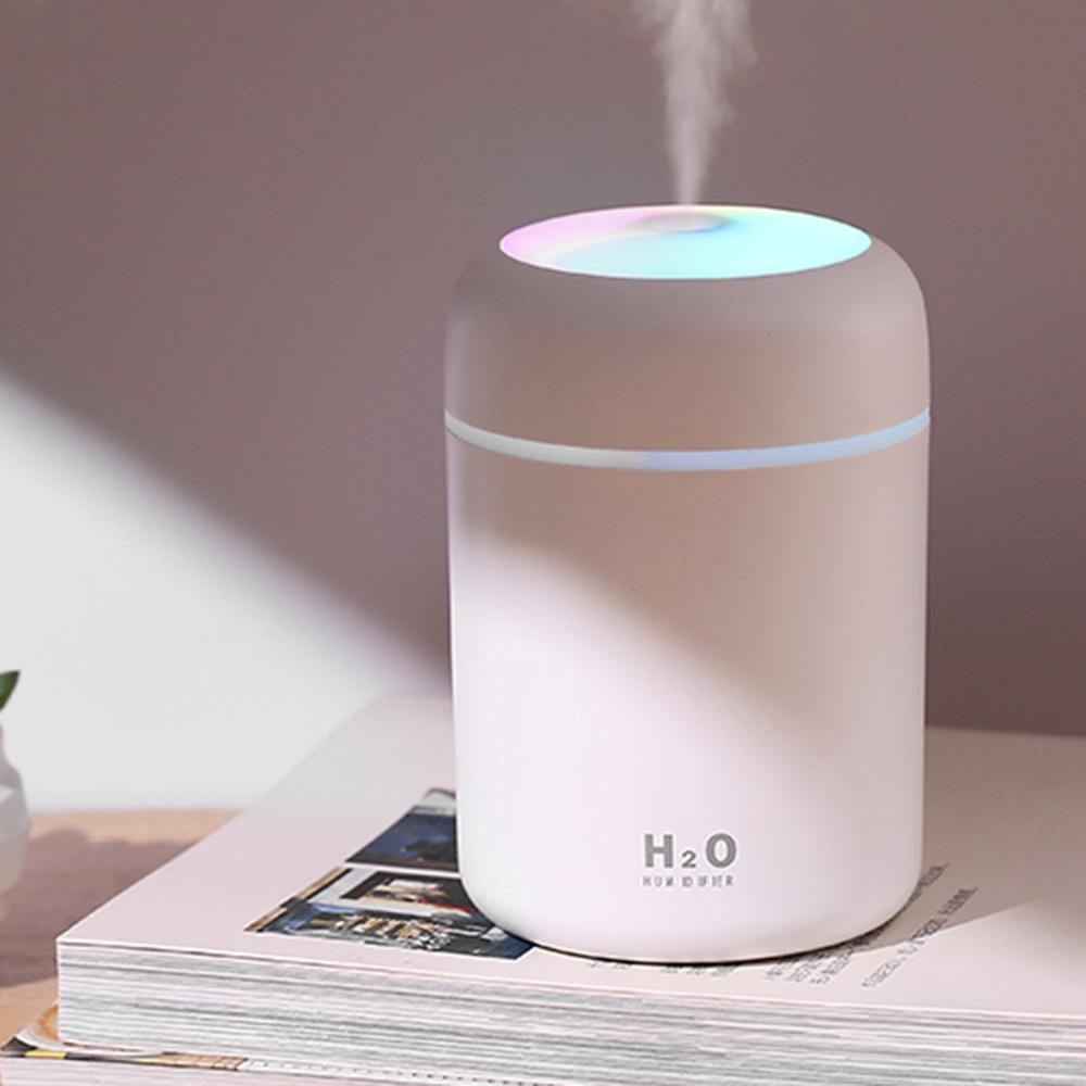 A serene image of the white aromatherapy diffuser in action, releasing a soft mist accompanied by a calming LED glow, creating a peaceful ambiance.