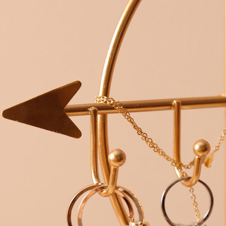 Close-up of the arrow detail on the VibeCore Arrow Jewelry Stand in Gold, highlighting its sleek design and precise craftsmanship, perfect for displaying jewelry.