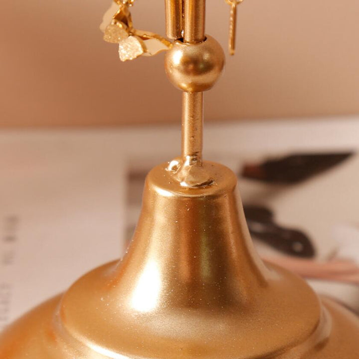 Close-up of the base of the VibeCore Arrow Jewelry Stand in Gold, showcasing its sturdy metal construction and sleek, minimalist design for a stable jewelry display.