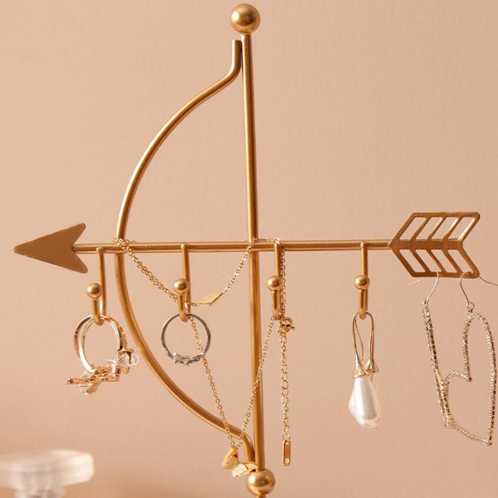 Close-up of the VibeCore Arrow Jewelry Stand in Gold, showcasing its sleek design and sturdy metal construction, perfect for organizing necklaces and earrings.