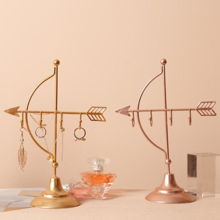 VibeCore Arrow Jewelry Stand in Gold, a sleek, minimalist design perfect for displaying jewelry. A stylish, space-saving organizer for necklaces and earrings.
