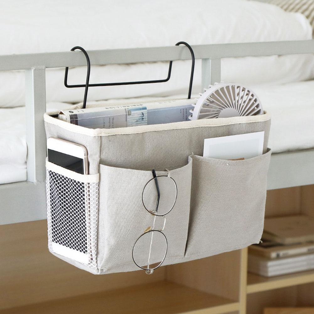 Space-saving bedside caddy with multiple pockets and hooks for storing essentials like phones, tablets, and books. Durable, portable, and easy to hang over your bed or furniture, ideal for small spaces like dorms and apartments.