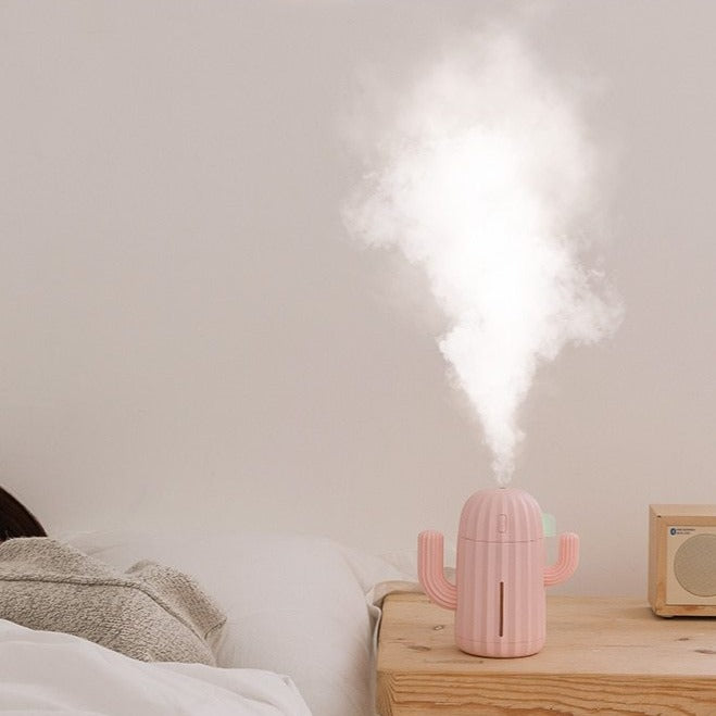 VibeCore Cactus Humidifier Blossom on side table with mist, featuring a playful cactus design, 340ml tank, and quiet operation, perfect for adding freshness and charm to any space.
