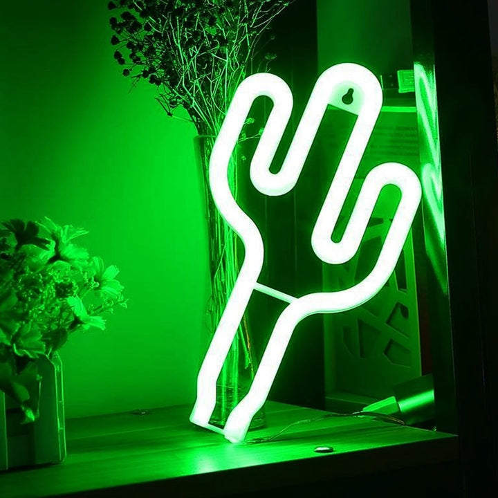 The VibeCore Cactus Neon Light leaning on a shelf adds a playful and vibrant touch to your space. Its green glow creates a fun, lively atmosphere, making it the perfect decor piece for any bedroom, dorm, or lounge.