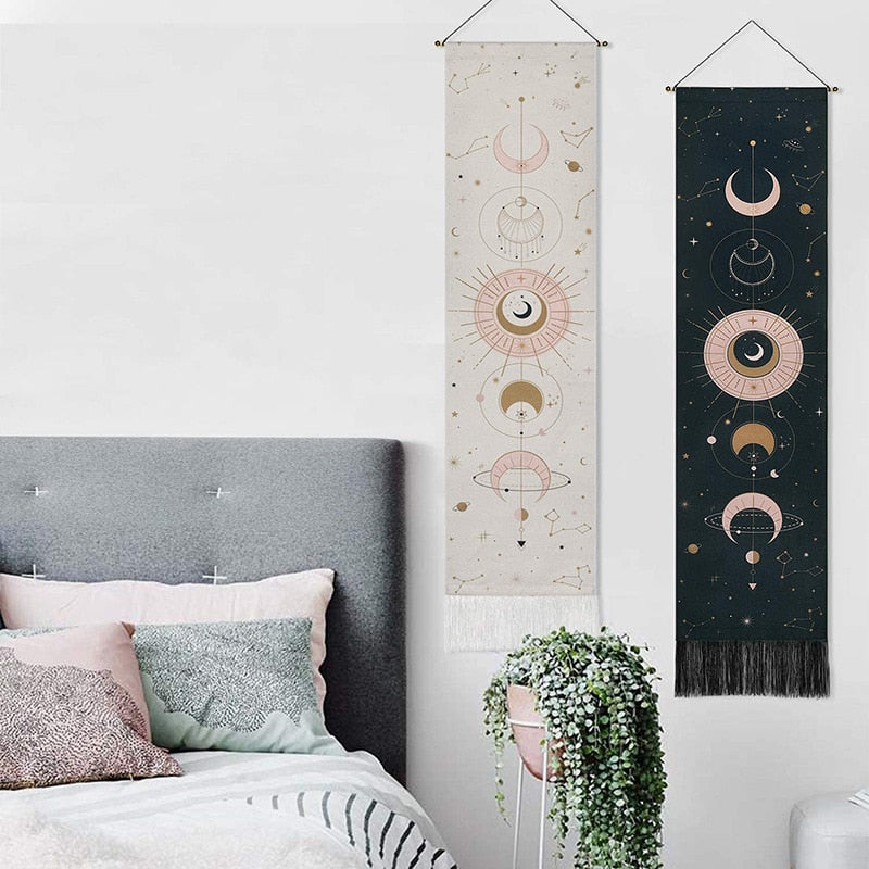 Celestial Moon Phases Wall Hanging in black and white on a wall beside the bed, featuring a mystical moon phase design that enhances the room’s celestial, boho-chic aesthetic.