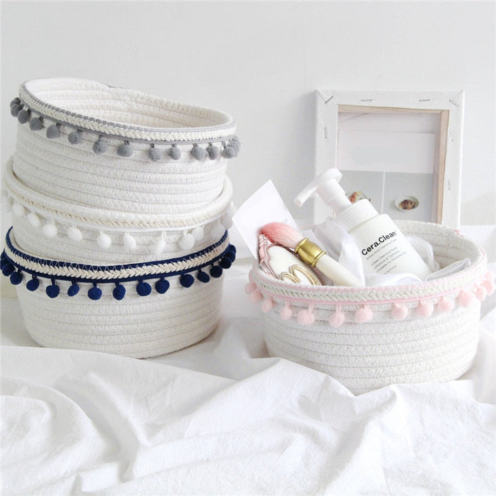 VibeCore Cotton Rope Storage Basket in light pink, handmade with natural cotton and jute, filled with products, providing a stylish and functional storage solution for your space.