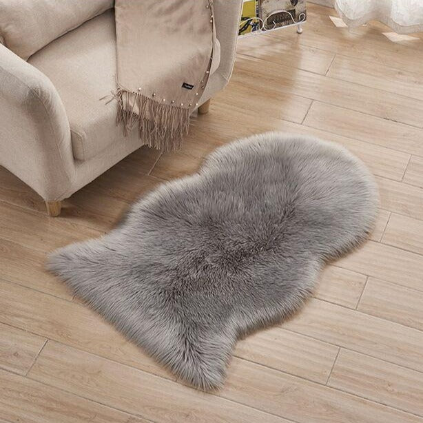 VibeCore Faux Sheepskin Rug/Chair Cover in gray, offering a plush, luxurious texture that enhances comfort and adds a cozy, chic touch to any room, perfect for use on the floor or as a stylish chair cover.
