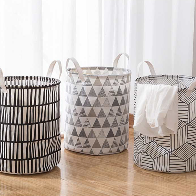 VibeCore Foldable Abstract Laundry Basket in all 3 patterns, featuring large-capacity, waterproof, and dustproof designs with reinforced handles for easy carrying.