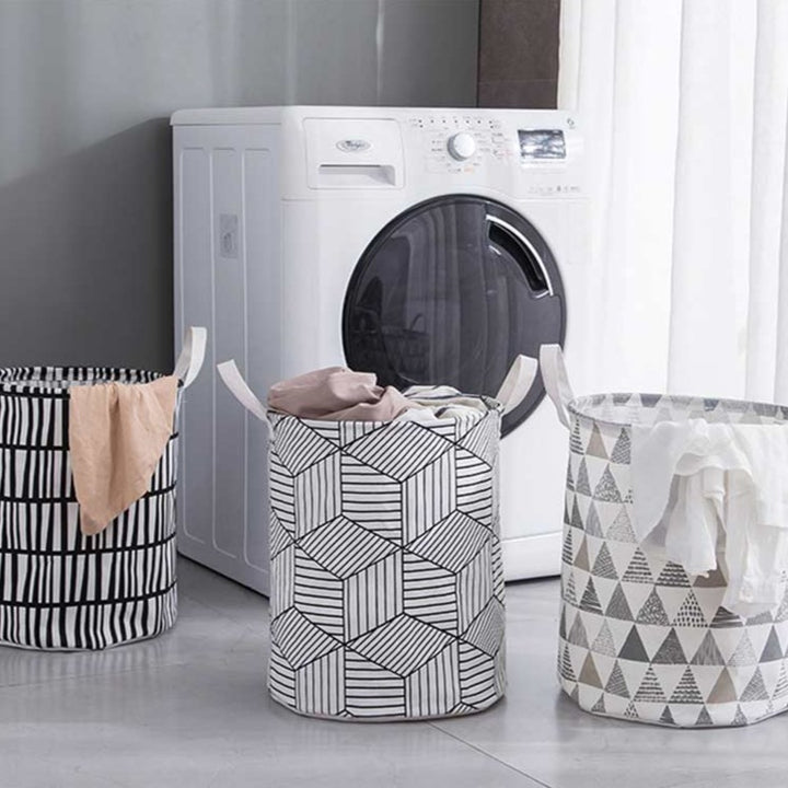 VibeCore Foldable Abstract Laundry Basket in all 3 pattern options, showcasing a large-capacity, waterproof, and dustproof design with reinforced handles for easy carrying.